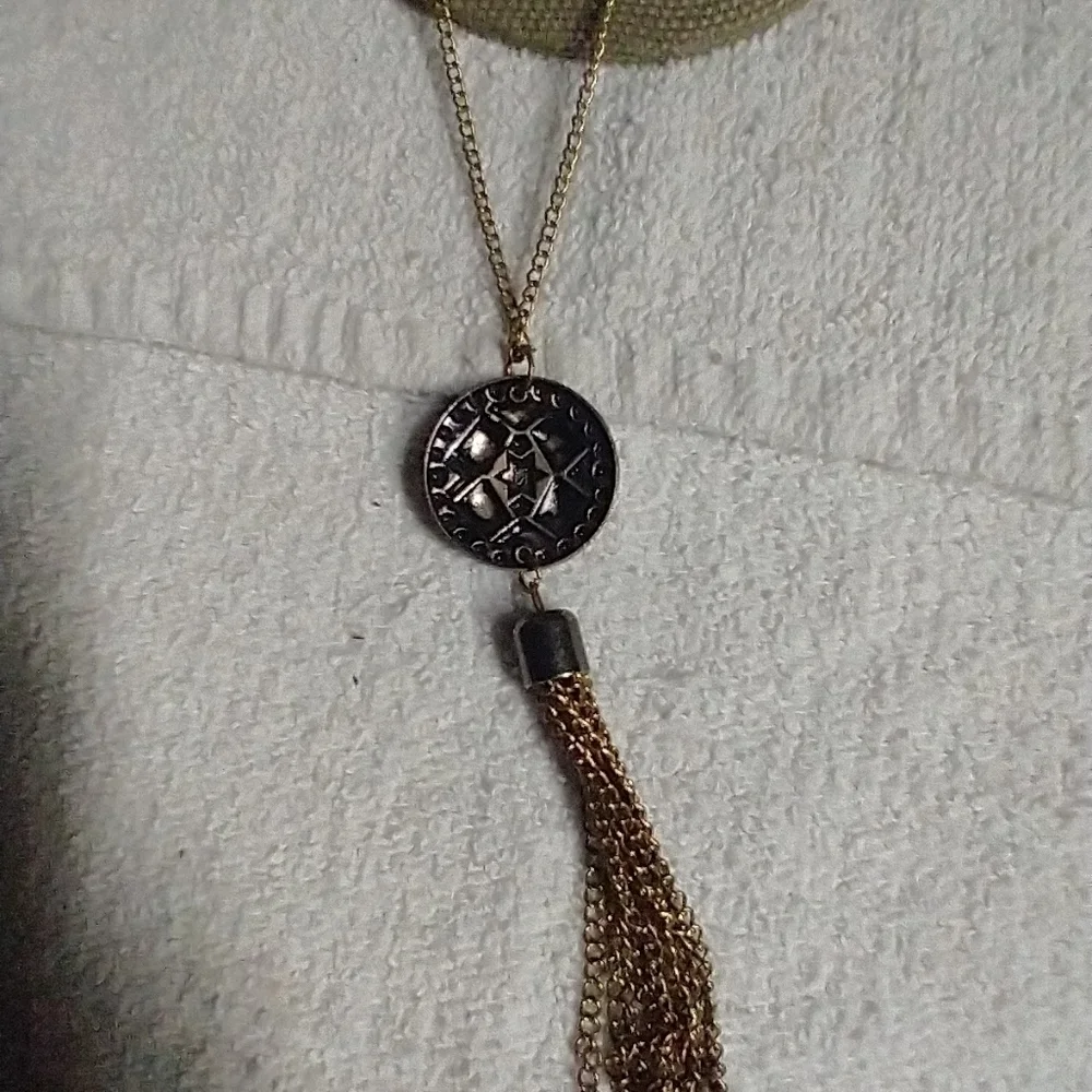 Long goldtone tassel coin chain necklace